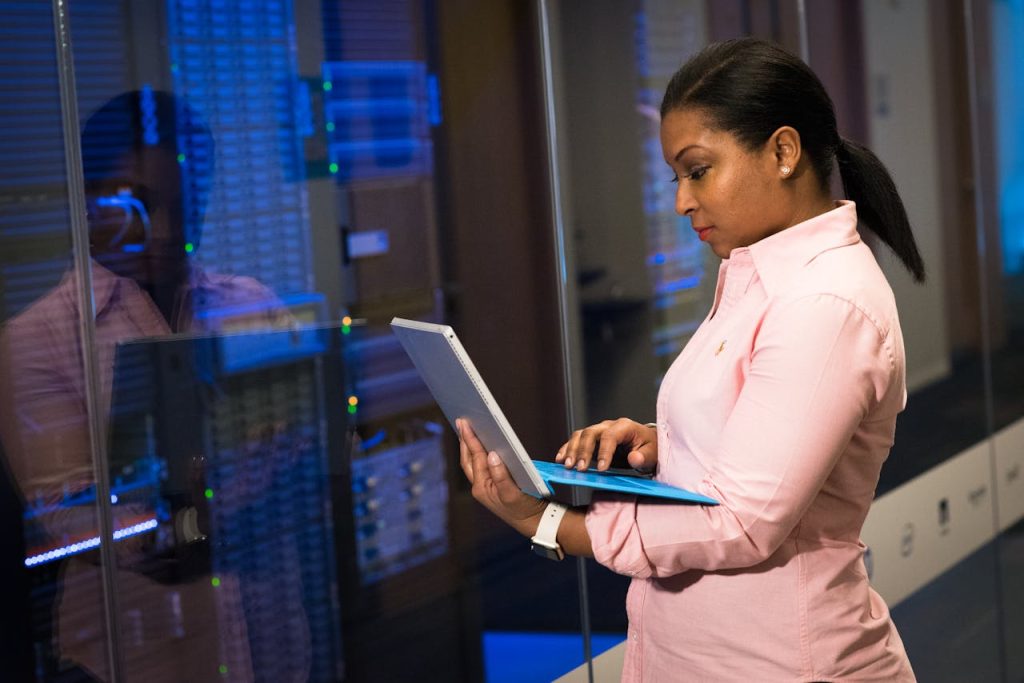 software-engineer-using-laptop-1181341 A focused software engineer working on a laptop in a server room, reflecting dedication in tech.